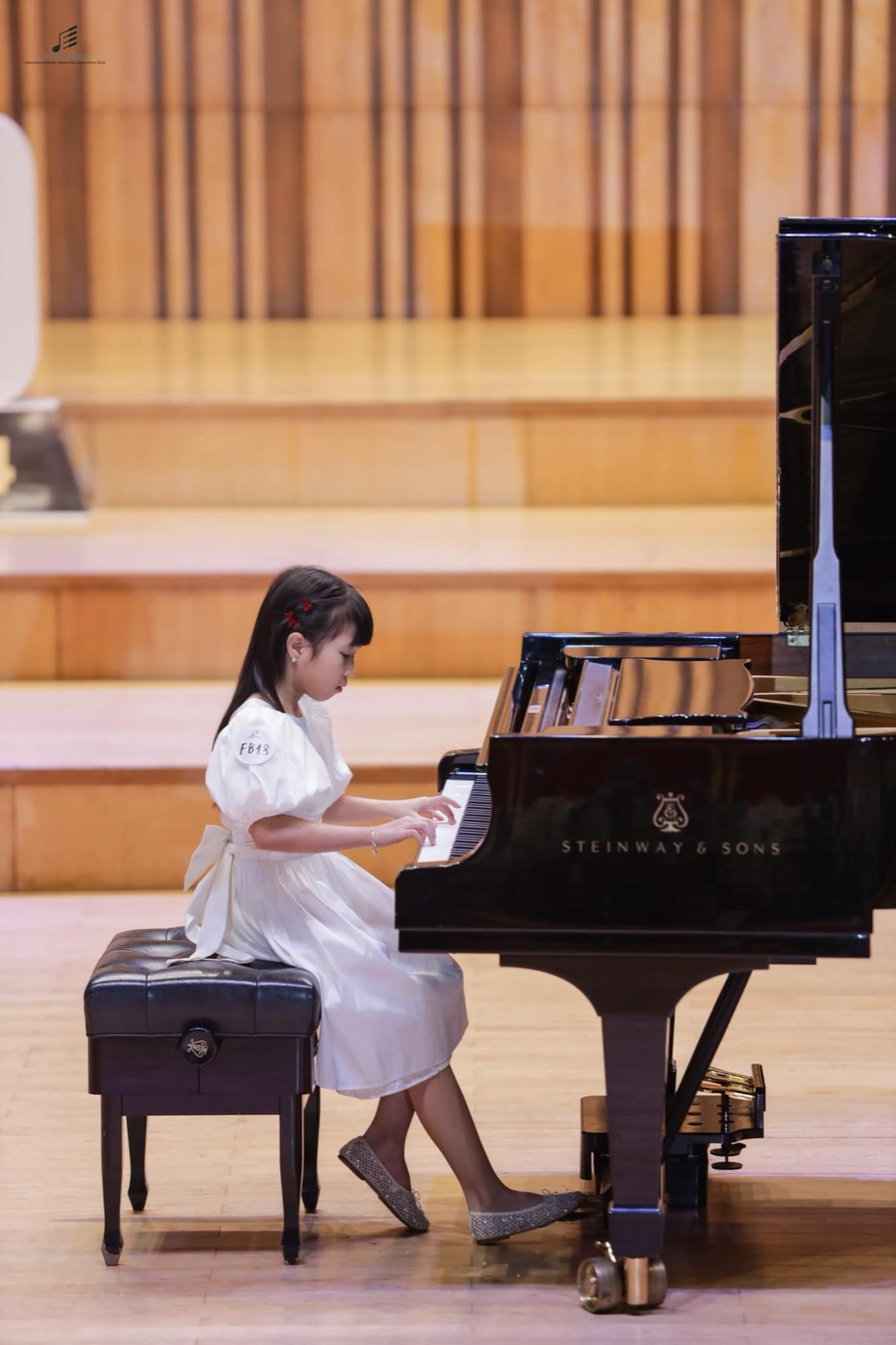 One of Ms Van's students performing on a Steinway grand piano in the final round of the Crescendo International Music Festival and Competition 2024